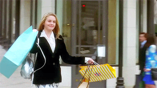 gif with girl with a lot of shopping bags in her hand