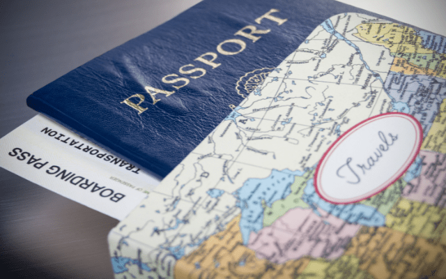 passport and printout of a world map