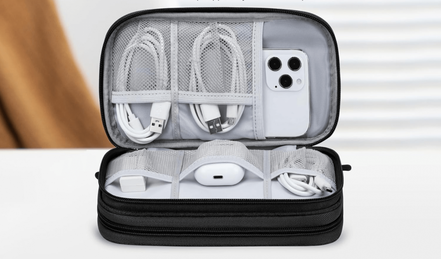 black tech organizer case with cables and chargers inside