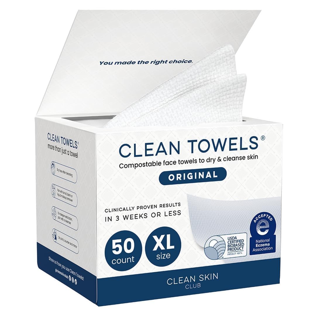 An open white and blue box of Clean Skin Club Clean Towels Original containing 50 extra-large, compostable face towels designed to gently dry and cleanse skin.