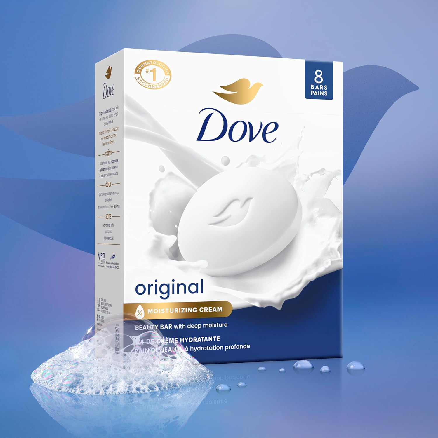 A white and dark blue box of Dove Original Beauty Bar soap shown splashing into a pool of creamy, moisturizing water surrounded by soapy suds.